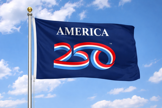 Flag with 'AMERICA 250' design against a blue sky